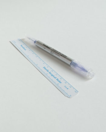 Surgical skin marker including sterile surgical ruler.
